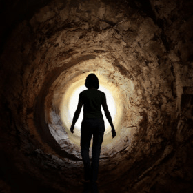 Sillhouette of a woman in a tunnel