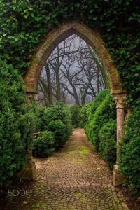 Stone and brick archway in garden